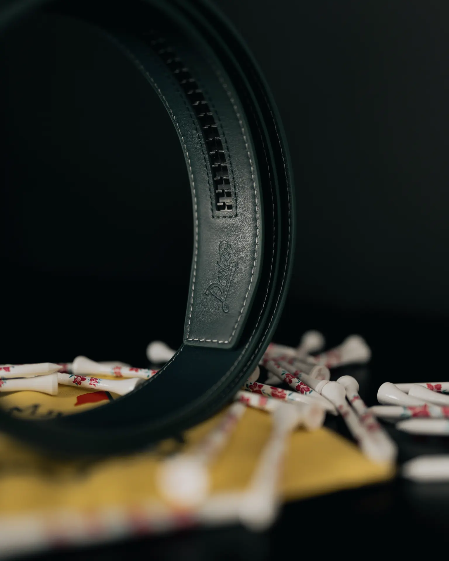 Debossed Dartee logo on the belt interior